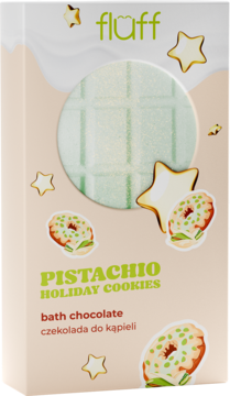 Fluff Pistachio Holiday Cookies bath chocolate w beżowym pudełku. Widoczna zielona tabliczka, gwiazdki i ciasteczka pistacjowe.