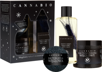 Zestaw Cannabio Bałtycki z węglem aktywnym: czarne pudełko, olejek z kłosami, peeling i czarna kula kąpielowa.