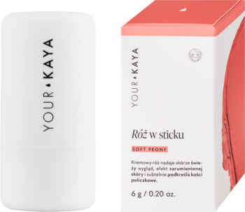 Biały róż w sticku YOUR KAYA Soft Peony z logo, obok pudełka z widocznym różowym odcieniem.