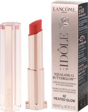 Lancôme Idôle Squalane-12 Butterglow, koralowa pomadka w rose gold etui, otwarta, obok jej czarne pudełko.