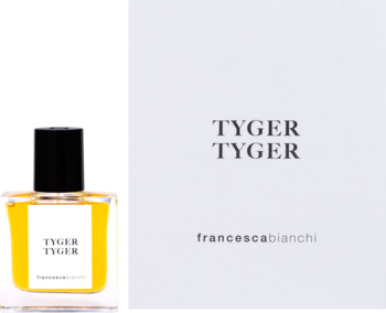 Francesca Bianchi Tyger Tyger, ekstrakt perfum w żółtej butelce, widok z boku obok białego pudełka.