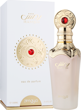 Zimaya Rameh woda perfumowana. Biała butelka ze złotymi zdobieniami i czerwonym kamieniem, stojąca przed pudełkiem.