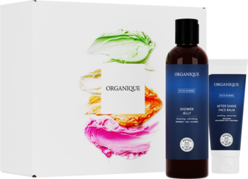 Zestaw Organique Pour Homme: brązowy żel, biały balsam po goleniu i karta z kolorowymi smugami, widok frontalny.