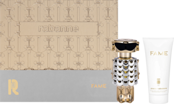 Zestaw Paco Rabanne Fame: złote perfumy w kształcie robota i balsam do ciała w białej tubce, obok pudełka.