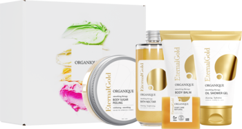 Zestaw kosmetyków Organique Eternal Gold o perfumeryjnym zapachu dla skóry suchej, złote tuby i słoiki.