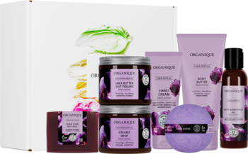 Zmysłowy zestaw kosmetyków Black Orchid Ritual do SPA: białe pudełko, fioletowe tubki, słoiki, kula, mydło.