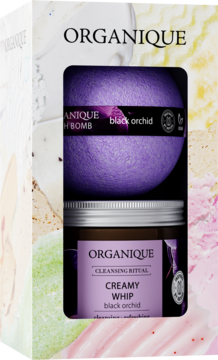 Frontalny widok zestawu prezentowego Organique Black Orchid: kula do kąpieli i pianka do ciała w białym pudełku.