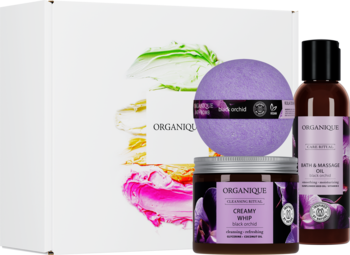 Organique Orchid Moments zestaw: białe pudełko, fioletowa kula, pianka i olejek Black Orchid. Widok z przodu.