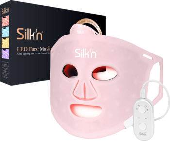 Różowa maska Silkn LED na twarz z czerwonym światłem i pilotem, czarne pudełko. Poprawia skórę, zwalcza starzenie.