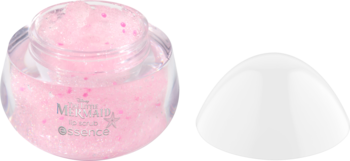 Otwarty, przezroczysty słoiczek z różowym peelingiem do ciała Milk Essence z drobinkami, obok białe wieczko.