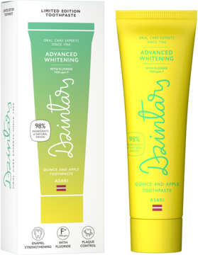 Dzintars Advanced Whitening Quince and Apple – żółta tubka i biało-zielone pudełko pasty do zębów, widok z przodu.
