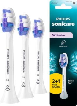 Trzy białe końcówki Philips Sonicare S2 Sensitive Extra Soft z fioletowymi włoskami, obok opakowania 2+1 gratis.