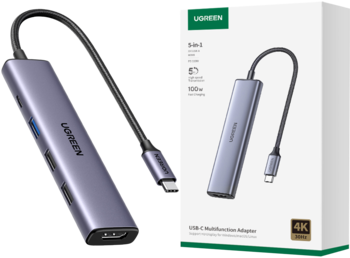 Srebrny adapter UGREEN USB-C 5w1 z portami HDMI i USB-A, widoczny z kablem obok białego opakowania.