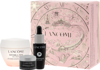 Zestaw Lancôme: krem Hydra Zen, serum Génifique i krem pod oczy, na tle bogato zdobionego, różowego pudełka prezentowego.