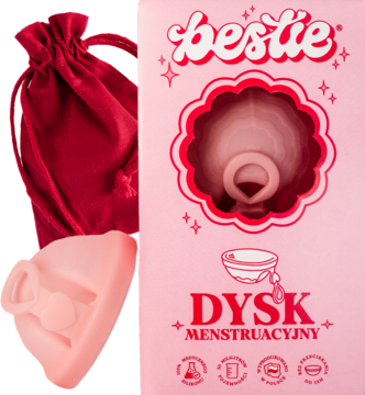 Jasnoróżowy dysk menstruacyjny Bestie z pętelką, w czerwonym woreczku obok różowego opakowania z napisem.