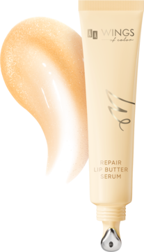 Serum do ust AA Wings of Color Repair Vanilla Shimmer w beżowej tubce, z metalowym aplikatorem i błyszczącą próbką.