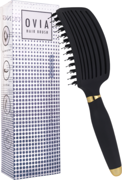 Czarna szczotka Ovia z włosiem dzika i wentylacją, złoty detal, obok białe pudełko z logo. Widok boczny.