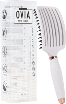Biała, wentylowana szczotka Ovia Sister Young obok opakowania. Widoczne włosie i uchwyt z różowego złota.