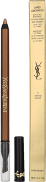 Otwarta brązowa kredka do oczu YSL Lines Liberated Bronze z blenderem i złote opakowanie obok.