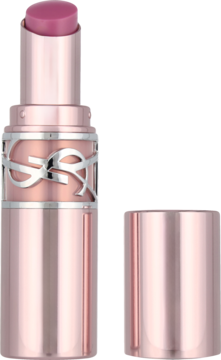 Luksusowa szminka YSL w odcieniu fuksji, w metalicznej, różowo-złotej tubce, z otwartą nakrętką obok.