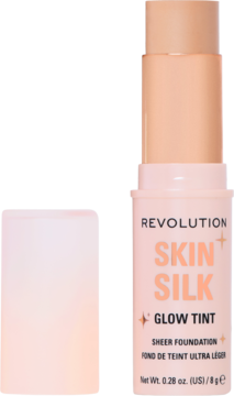 REVOLUTION SKIN SILK Glow Tint, rozświetlający podkład w sztyfcie, otwarty, widok z przodu na beżowy odcień.
