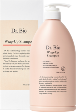 Różowy szampon Dr. Bio Wrap-Up w butelce z pompką 750 ml, z częściowo widocznym beżowym opakowaniem.