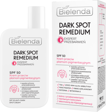 Bielenda DARK SPOT REMEDIUM SPF 50 krem przeciw plamom pigmentacyjnym w białej butelce z pompką i pudełku, widok z przodu.