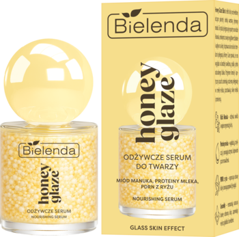 Bielenda Honey Glaze Odżywcze Serum do Twarzy, szklany słoik z żółtymi kuleczkami i żółtym opakowaniem, widok z przodu.