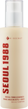 K-SECRET SEOUL 1988 Essence, beżowa butelka z białym pompką. Snail Mucin 97% + Rice, widok frontalny.