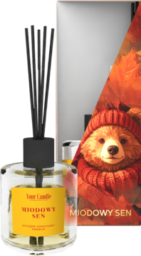 Your Candle Miodowy Sen dyfuzor zapachowy w szklanej butelce z czarnymi patyczkami, na tle jesiennego misia.