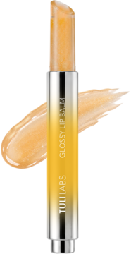 Balsam Tuli Labs Glossy Lip Balm, otwarty, złoty z połyskiem, z widoczną próbką koloru, metaliczne opakowanie.