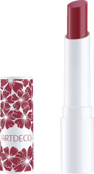 Otwarty balsam Artdeco Color Booster Lip Balm Berry. Biały sztyft z różowym kolorem, obok wieczko z czerwonymi kwiatami.