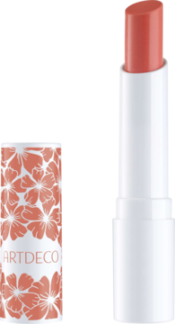 Otwarty balsam do ust Artdeco Color Booster Apricot, biała tubka z różowo-koralową nakładką w kwiaty.