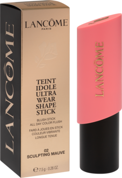 Lancôme Teint Idole Ultra Wear Shape Stick Blush 02 Sculpting Mauve, różowy sztyft obok beżowego pudełka produktu.