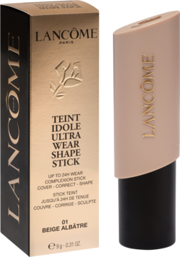 Lancôme Teint Idole Ultra Wear Shape Stick, beżowy podkład w sztyfcie 01 Beige Albâtre obok złotego pudełka.