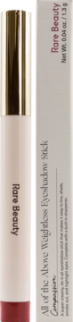 Rare Beauty All of the Above Weightless Eyeshadow Stick in Compassion, standing next to its light grey box.