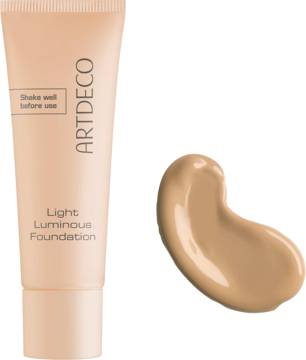 Rozświetlający podkład Artdeco Light Luminous Foundation w beżowej tubce, obok próbka Warm Golden Tan.
