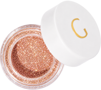 Otwarty sypki pigment Glamtes Peach Blossom, lśniące brzoskwiniowo-złote drobinki w słoiczku, biała nakrętka obok.