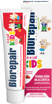 Biorepair Kids pasta do zębów 0-6 lat, ochrona przed próchnicą, bez fluoru, biała tubka i pudełko z grafiką truskawek i zwierząt.