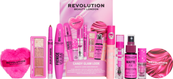 Wesoły różowy zestaw kosmetyków Revolution Candy Glow: tusz, cienie, błyszczyk, spray, serce. Widok z przodu.