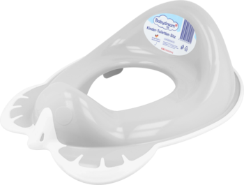 Biała nakładka na toaletę dla dzieci, przezroczysty plastik, z etykietą i ergonomicznym kształtem, widok z góry.