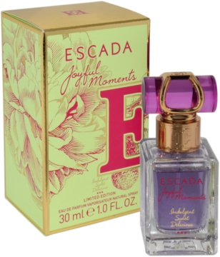 Woda perfumowana Escada Joyful Moments: fioletowa butelka z różowym korkiem obok zielono-złotego pudełka z kwiatami.