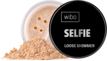 Złoty rozświetlacz Wibo Selfie Loose Shimmer w otwartym słoiczku, obok wysypany puder, czarna nakrętka.