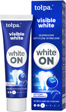 Pasta Tołpa Visible White ON, wybielająca do 3 odcieni, w niebieskiej tubce obok pudełka. Widok z przodu.