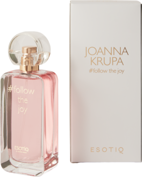 Esotiq Joanna Krupa #follow the joy: prostokątny flakon z różowym płynem i złotym korkiem obok białego pudełka.