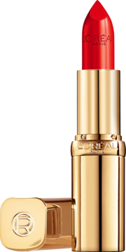 Złota pomadka L'Oréal Color Riche z wysuniętym czerwonym sztyftem i leżącą obok nakrętką z logo R.