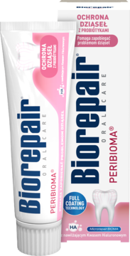 Pasta Biorepair PERIBIOMA dla dziąseł, biała tubka z różowymi akcentami i zębem, lekko pod kątem.