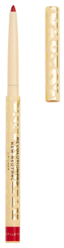 Czerwona kredka do ust Revolution Pro New Neutral Stiletto. Beżowo-złote opakowanie, odkryta końcówka, skuwka obok.