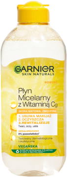 Garnier Płyn Micelarny z Witaminą Cg, przezroczysta butelka z żółtym płynem i grafiką cytryny, widok z przodu.