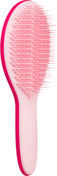 Różowa szczotka Tangle Teezer z rączką, widok z boku. Idealna do rozczesywania włosów, nadaje połysk.